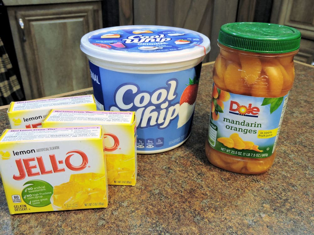 Jello, Cool Whip and mandarin oranges displayed on countertop