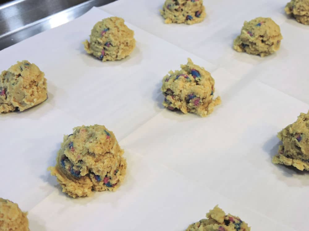 uncooked pudding cookies on sheet pan
