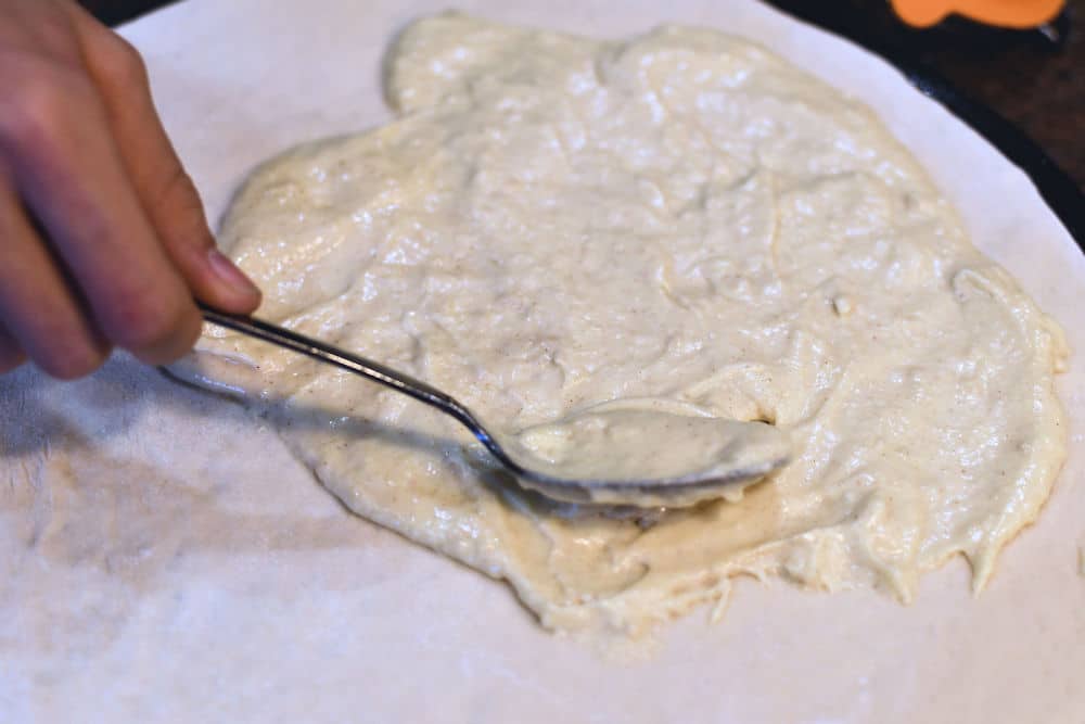 24Bite: spreading the homemade dijon sauce on the pizza dough