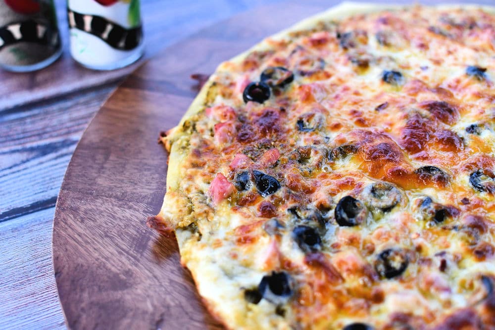 24Bite Recipe: Pesto Pizza With Ham and Black Olives by Christian Guzman