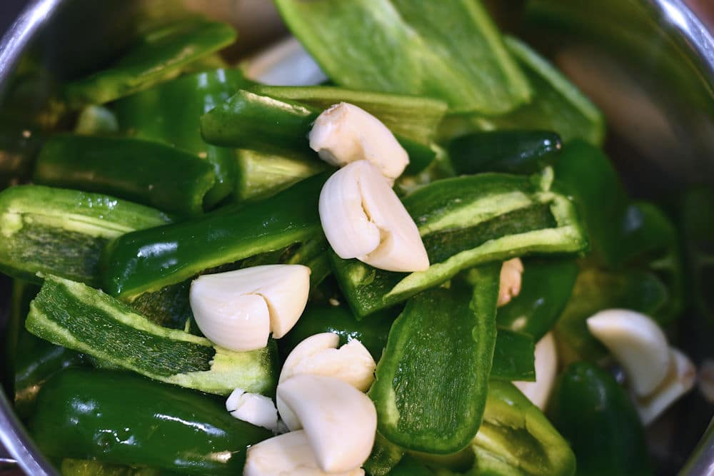 24Bite: Cut up anaheim peppers for homemade tamale sauce