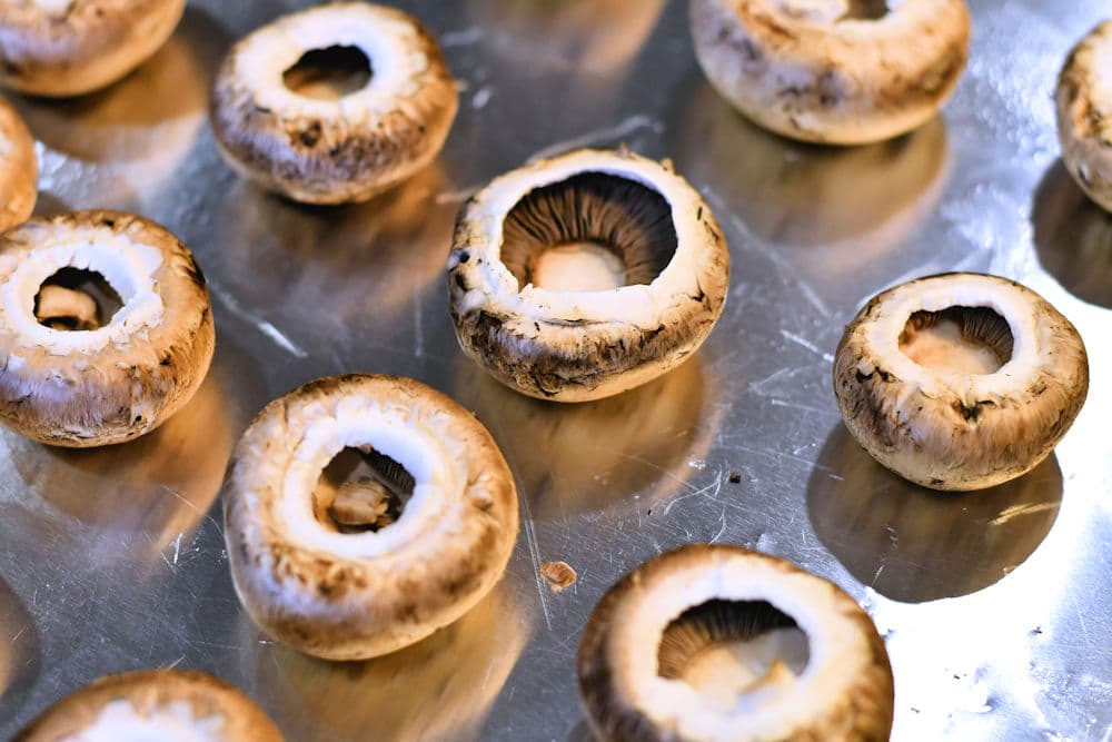 empty mushroom caps on baking sheet