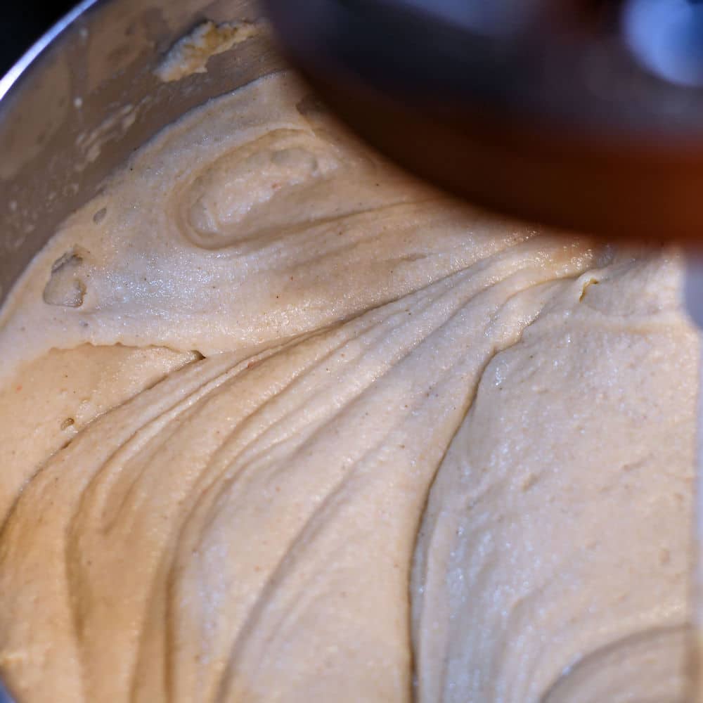 closeup image of masa dough in a standing mixer bowl