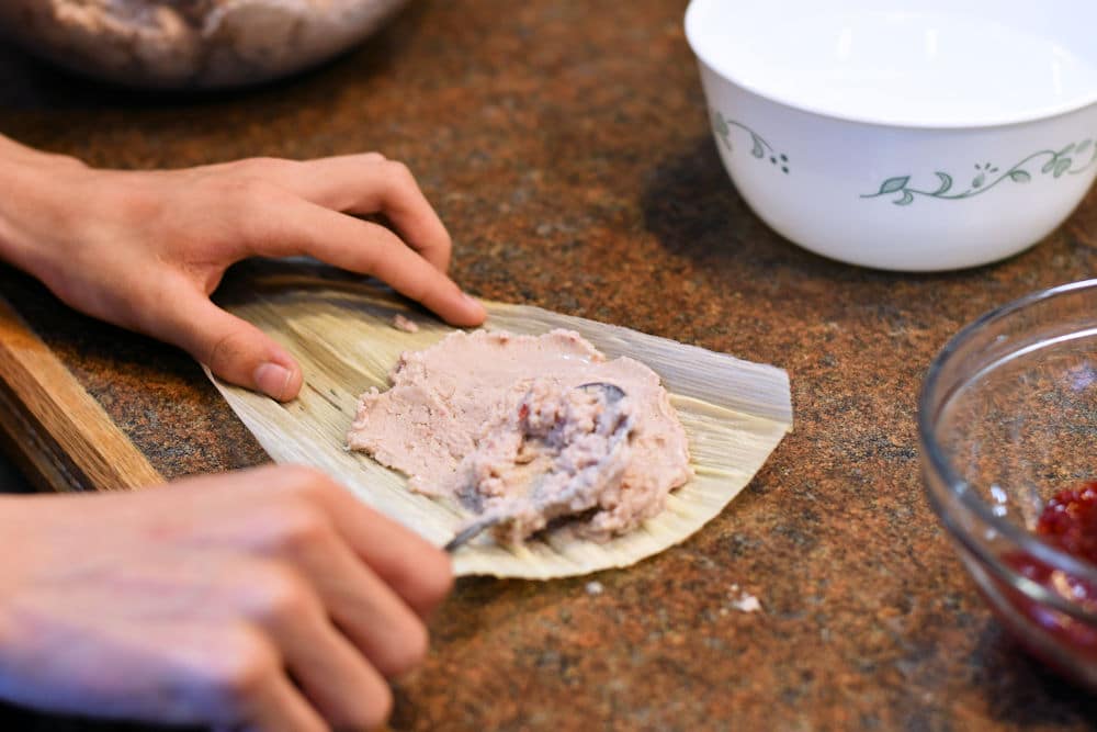 24Bite: spreading raspberry sweet masa dough on corn husk