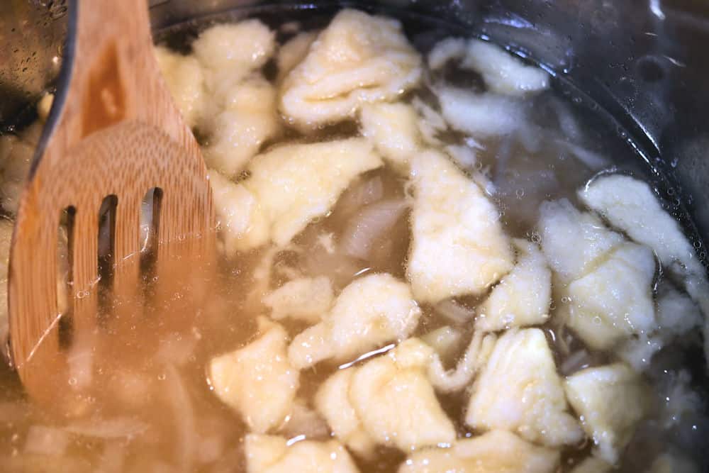 24Bite: dropping dough into chicken broth for chicken and dumplings