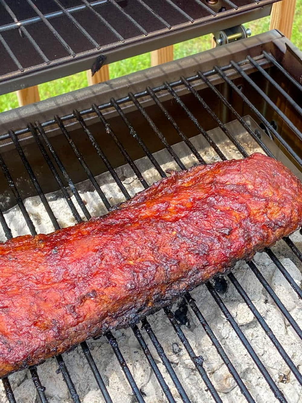 24Bite: Heavily sauced barbecue ribs on the grill