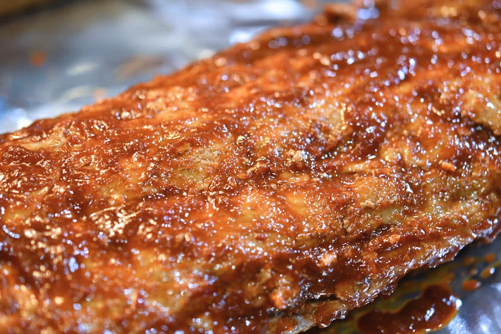 24Bite: Heavily sauced ribs on foil after boiling in water on the stovetop