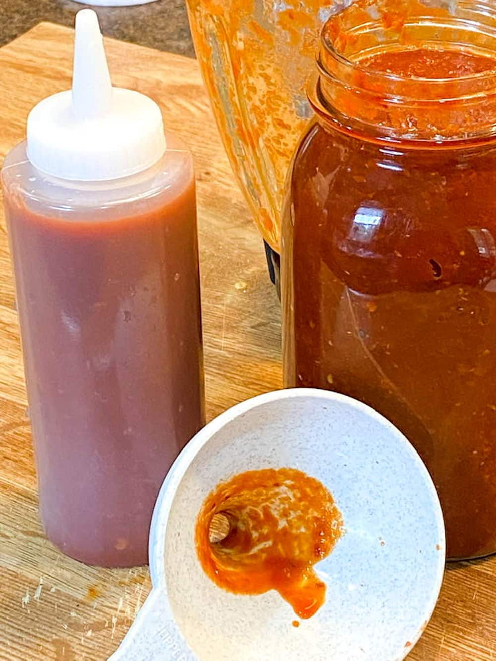 24Bite: Homemade spicy barbecue sauce made from dried red chiles and tomato in quart jar