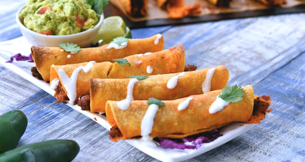 24bite: rectangle plate of baked cheeseburger rolled tacos