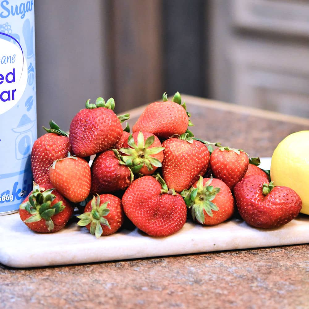 24Bite: Fresh strawberries on cutting board for strawberry jam