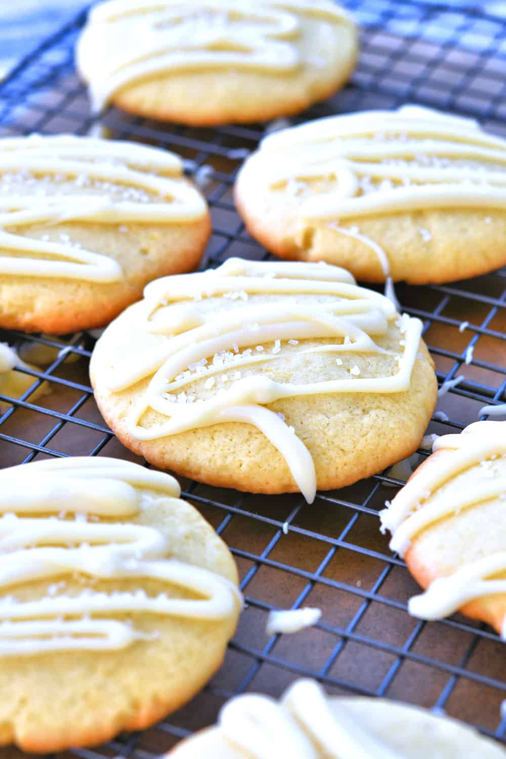 24Bite: lemon sugar cookies on wire rack after white chocolate drizzle