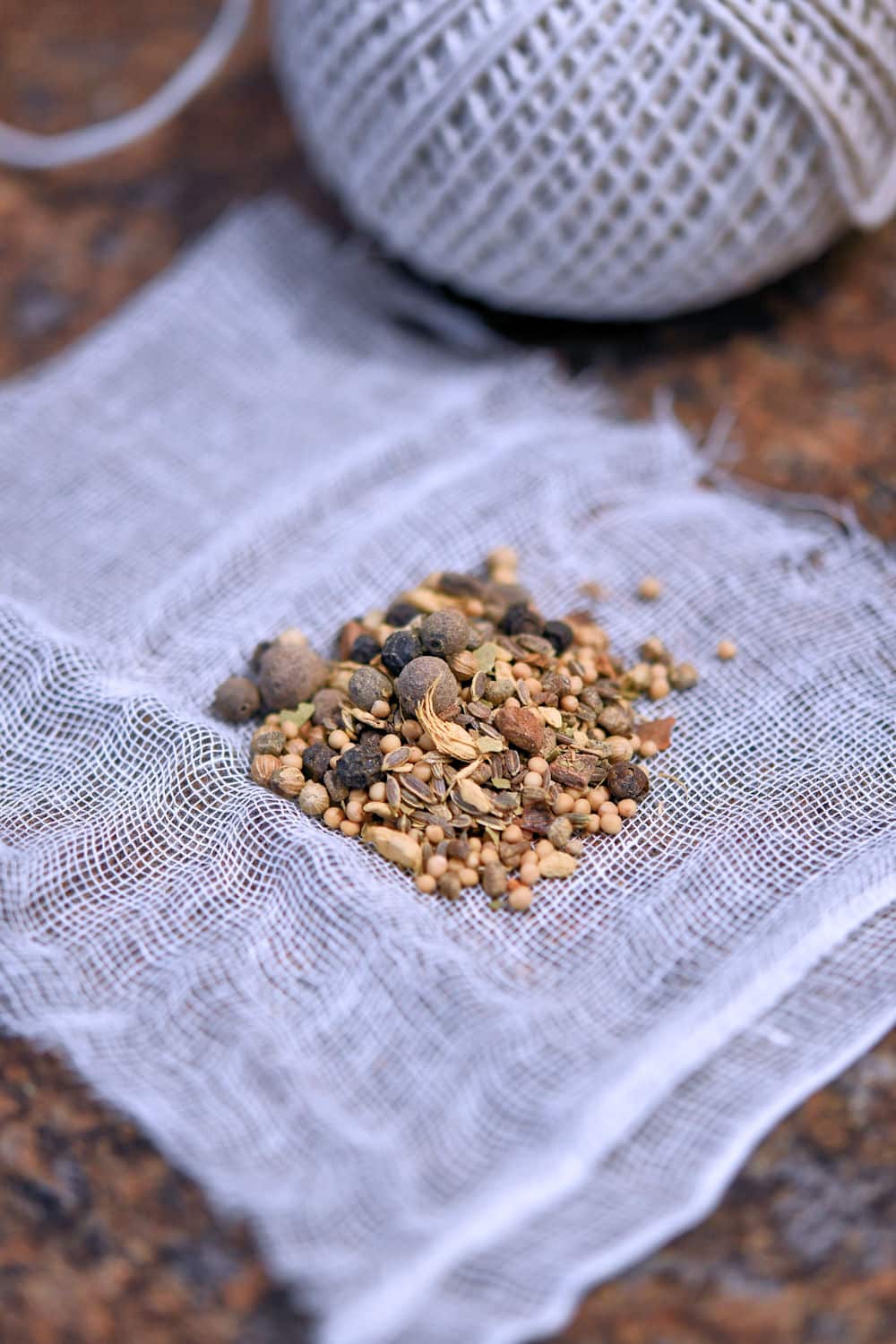 pickling spice on a small square of cheesecloth, ready to be tied and placed in saucepan