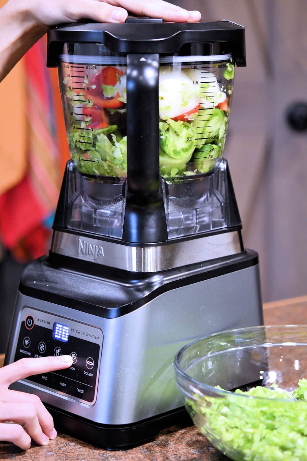 processing the raw vegetables in a food processor