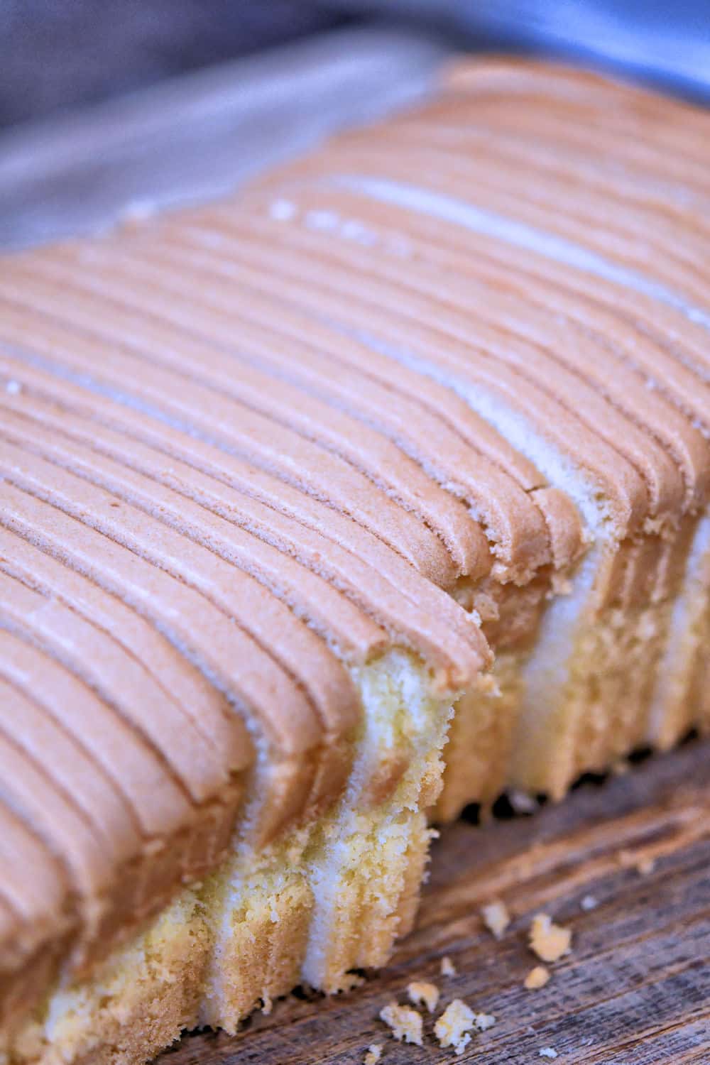 finely sliced pound cake on a cutting board