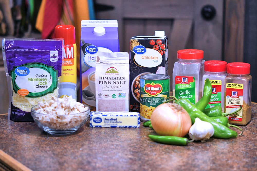 ingredients for green chile chicken soup, displayed on a counter top