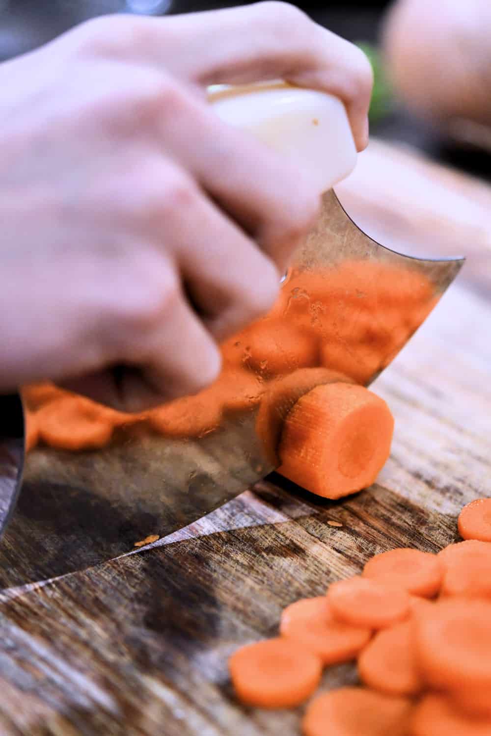slicing carrots with an ulu knife