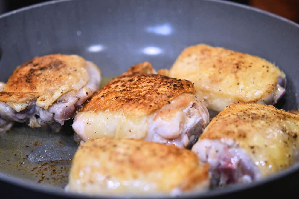 chicken thighs pan fried and golden brown