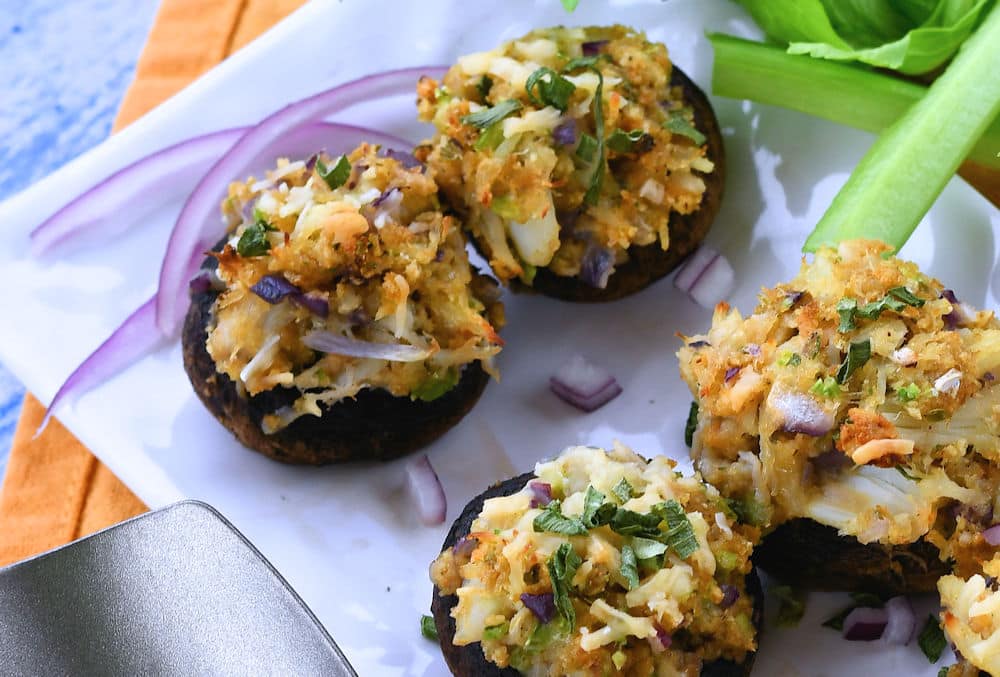 stuffed mushrooms after baking and placed on a white rectangle serving dish