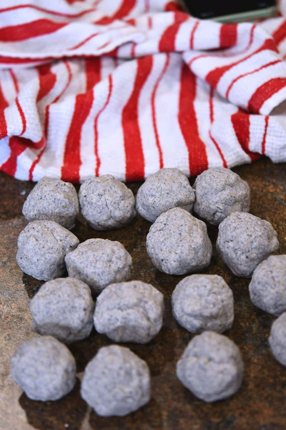 little balls of blue corn dough, ready for pressing to form tortillas