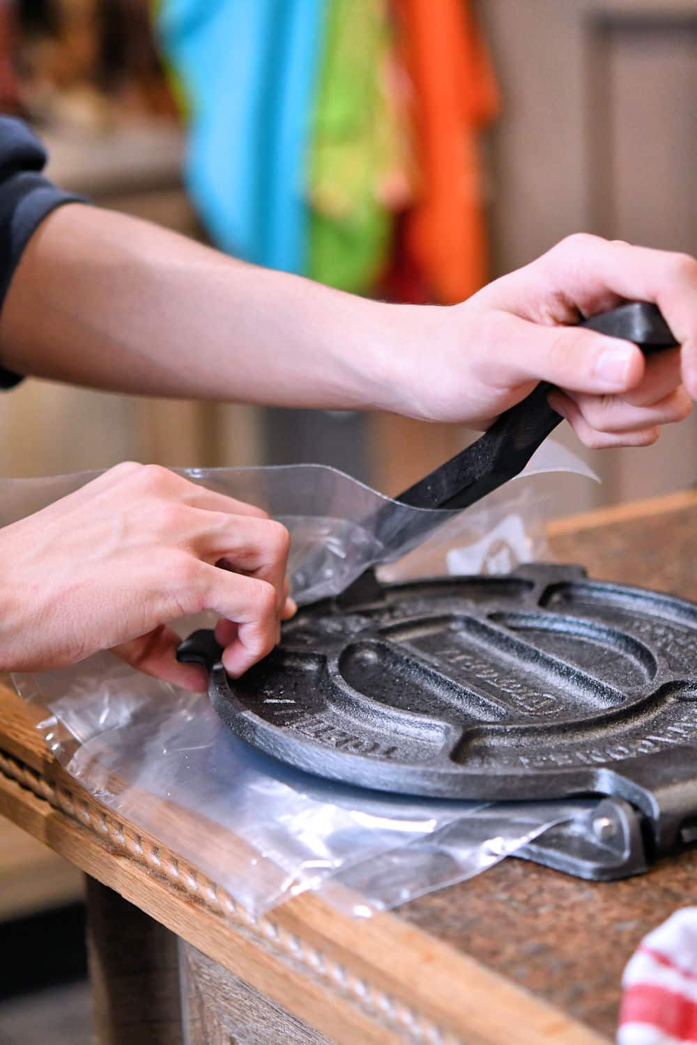 demonstration of using a cast iron tortilla press