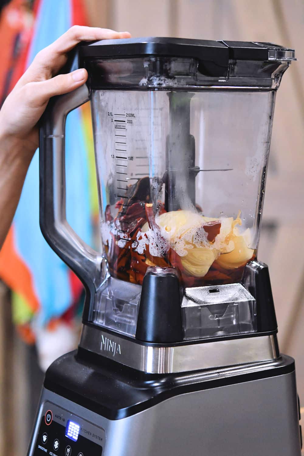 reconstituted chiles and onions in an electric blender ready to be blended