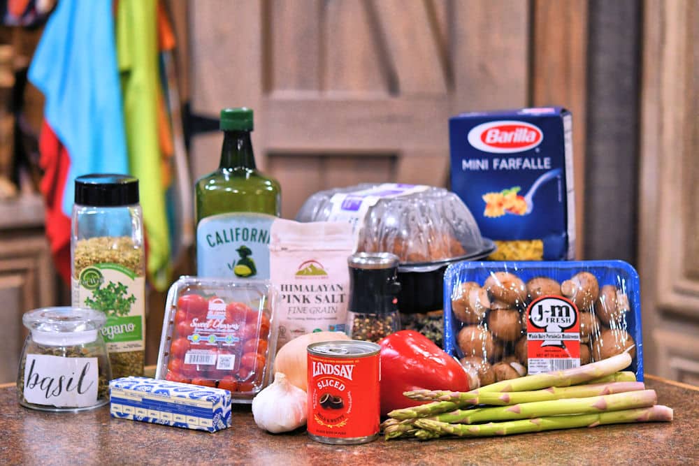 ingredients for chicken pasta dinner on countertop.