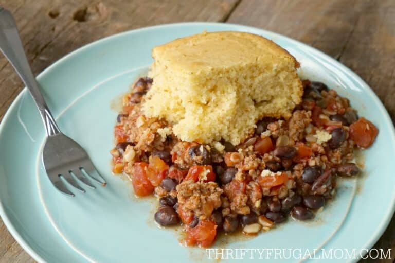 tamale pie made in a crockpot, served on an aqua plate
