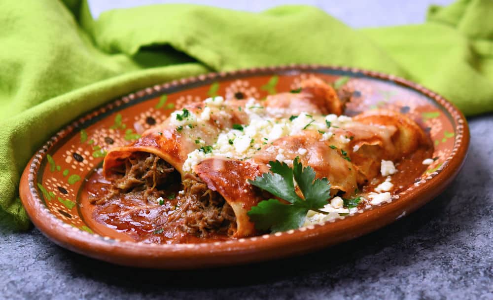 plate of beef green chiles enchiladas