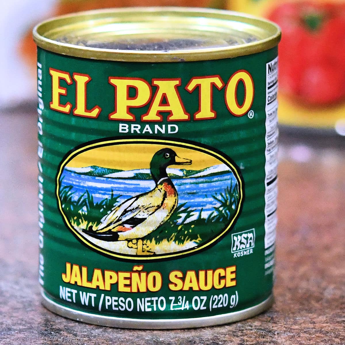 A can of El Pato Jalapeno Sauce on a countertop.