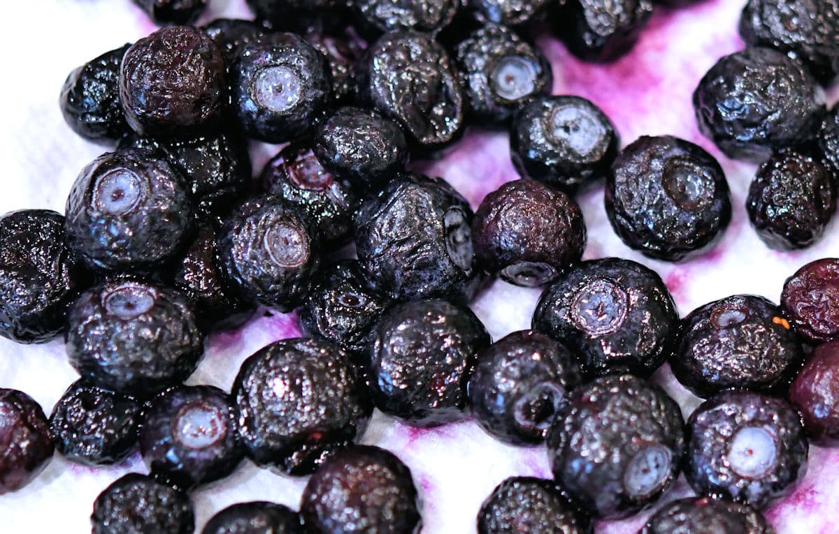frozen blueberries on a paper towel