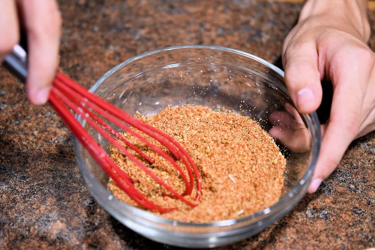mix ancho spice blend in a bowl by using a small whisk or spoon