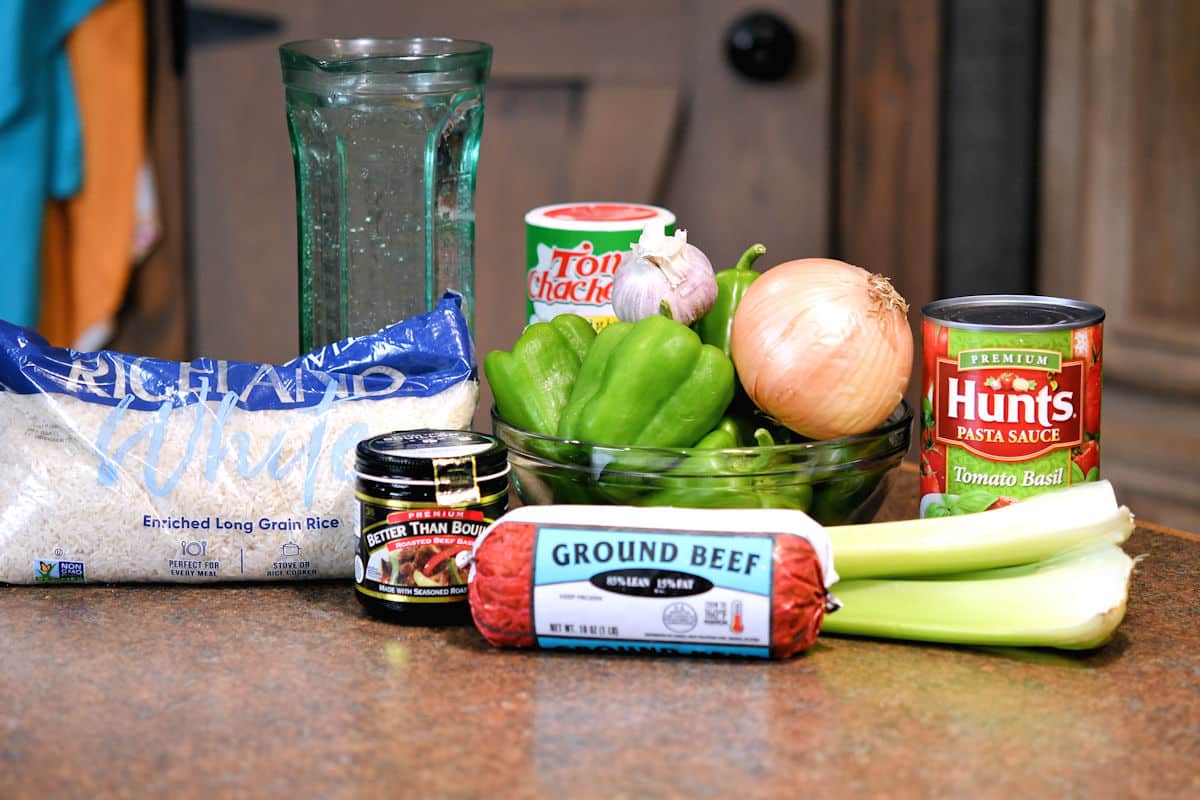 ingredients for dirty rice stuffed peppers on a countertop