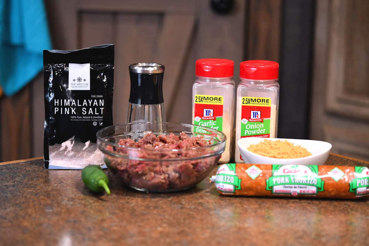 ingredients for chorizo venison burger on a countertop