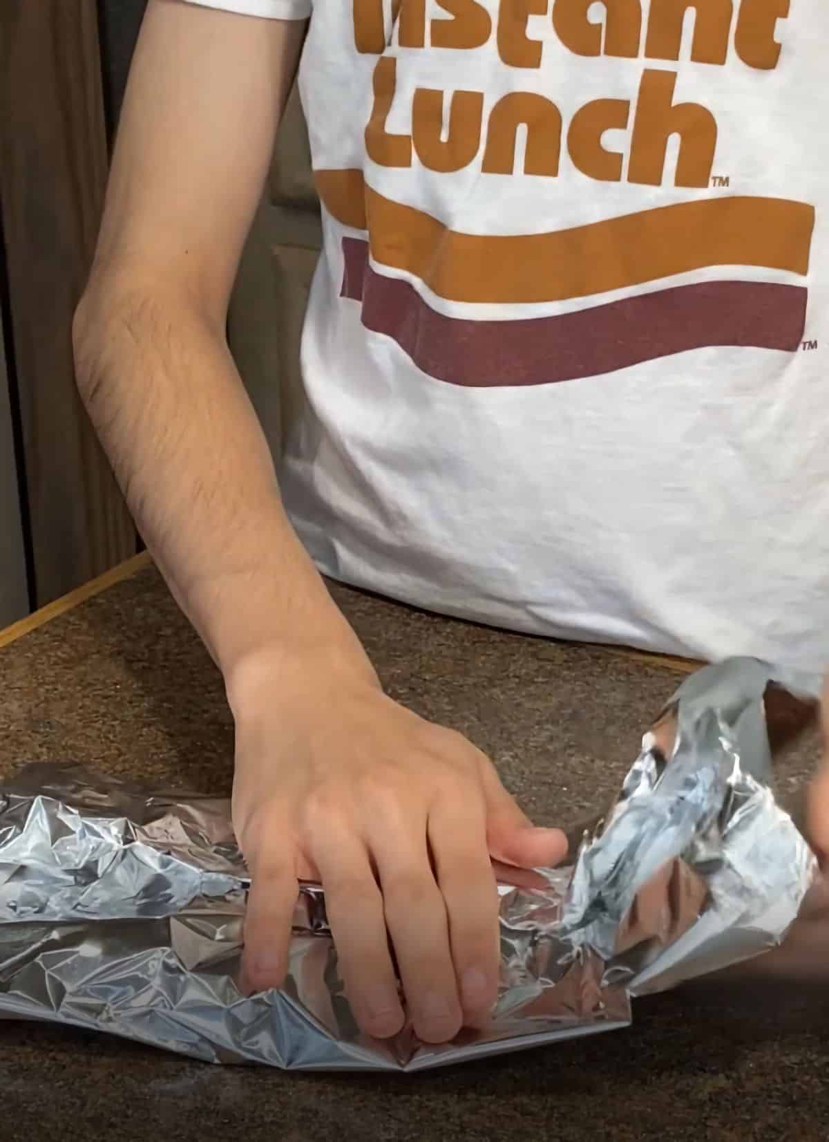 wrap venison burger into a foil packet for cooking