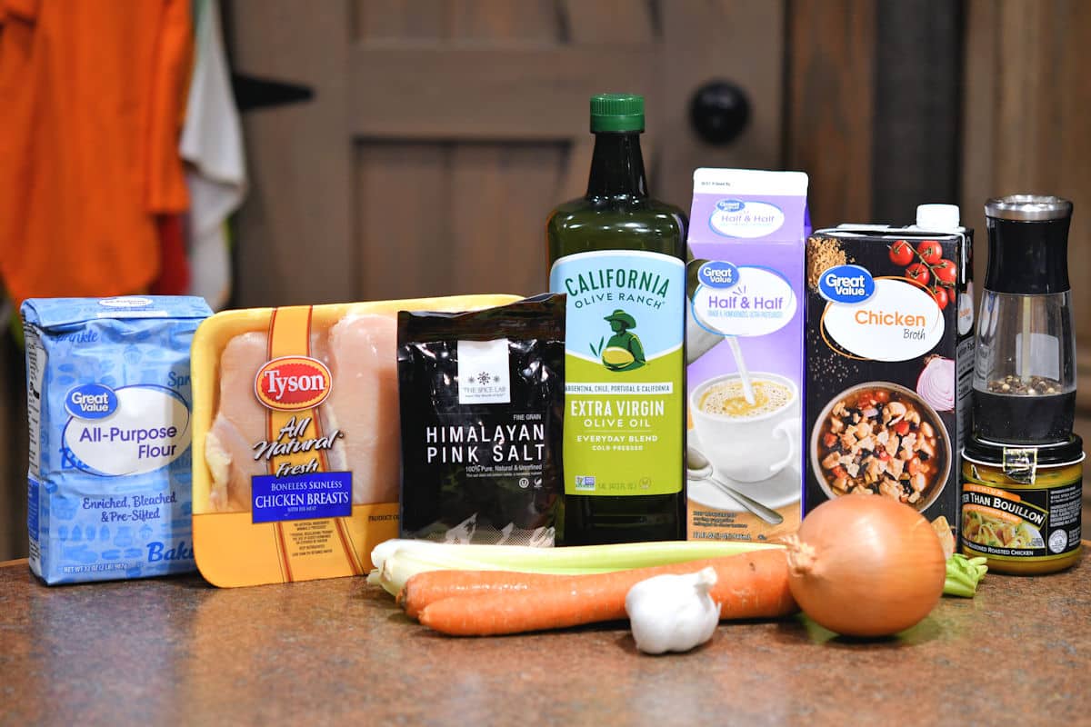 ingredients of creamy chicken soup on a countertop