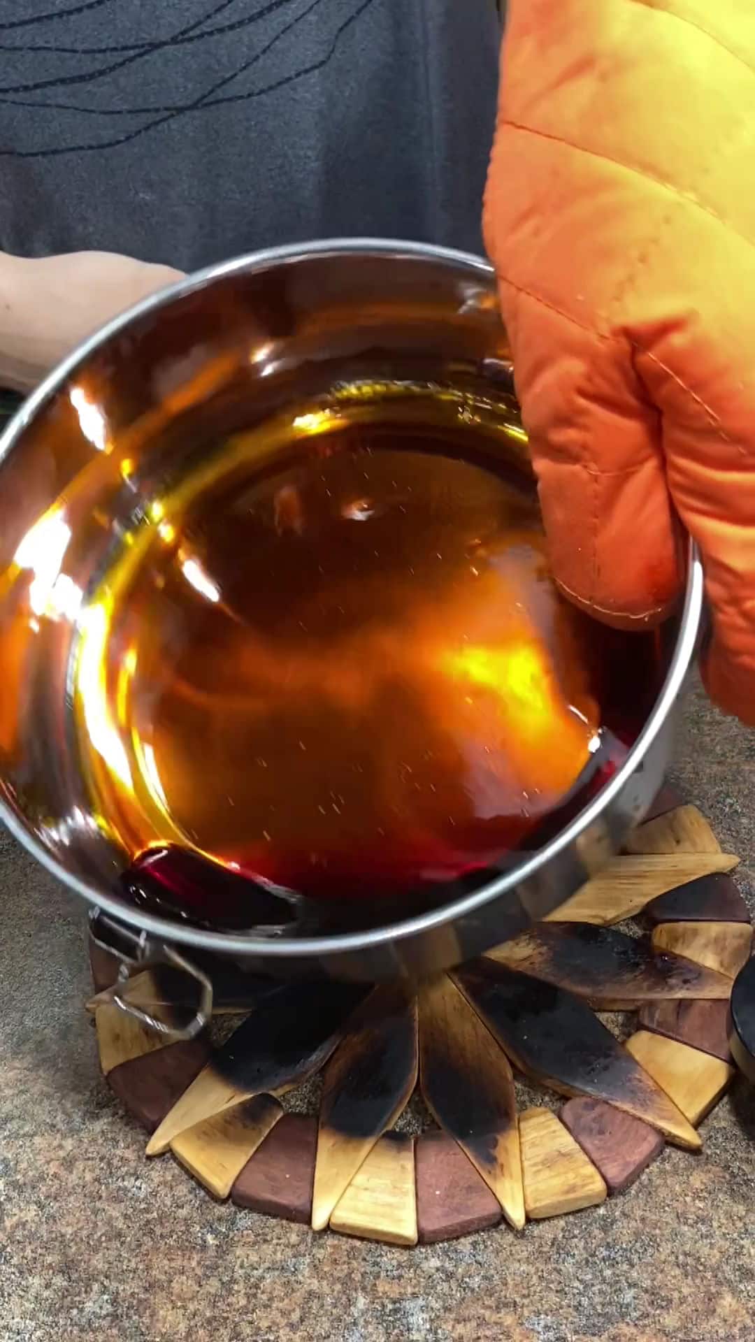 a demonstration of swirling the sugar syrup to coat the flanera pan.