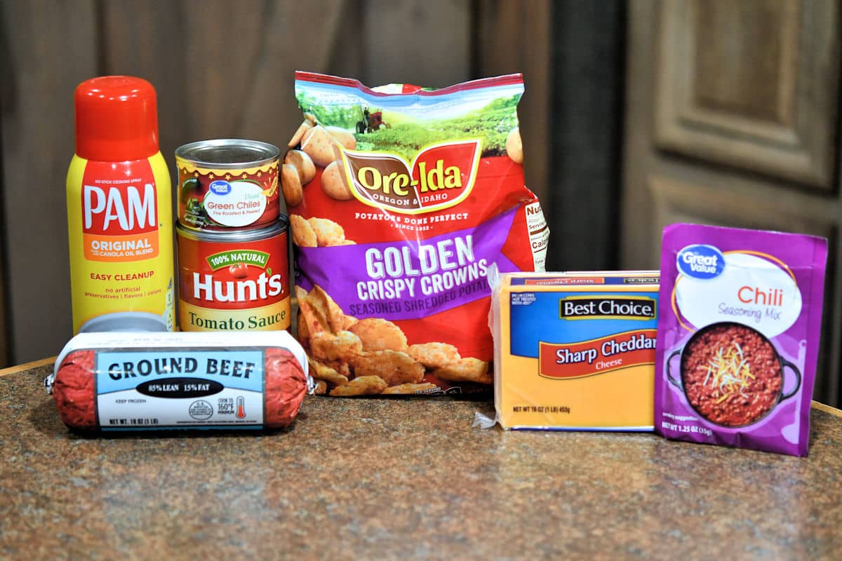 six ingredients for chlli cheese tater tots from recipe card, on a countertop.