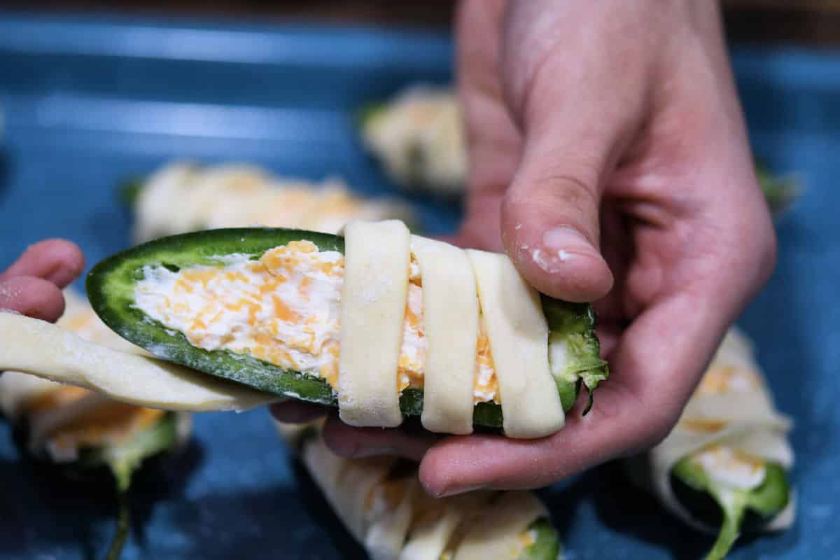 wrapping pastry around jalapeno