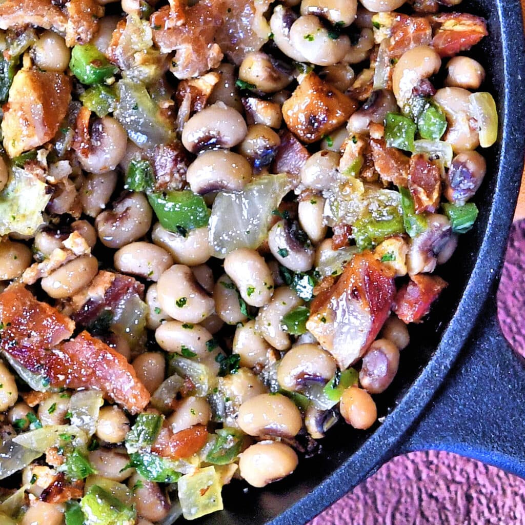 black eyed peas loaded in a cast iron skillet