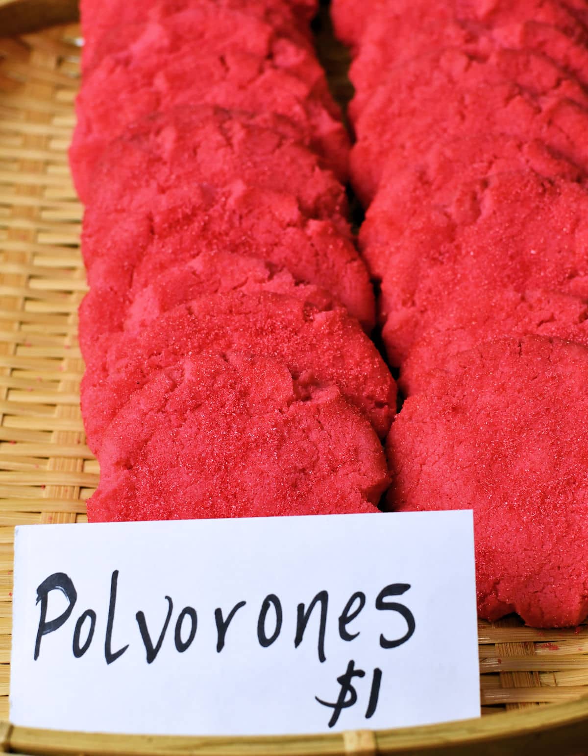 a displayed basket of Mexican Pink Cookies with a one dollar price