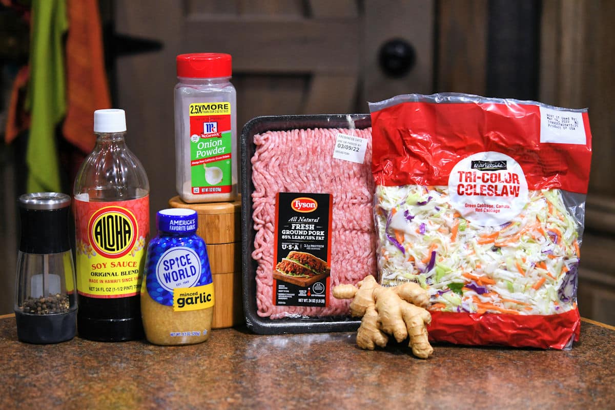 ingredients for pork egg roll in a bowl, sitting on a countertop