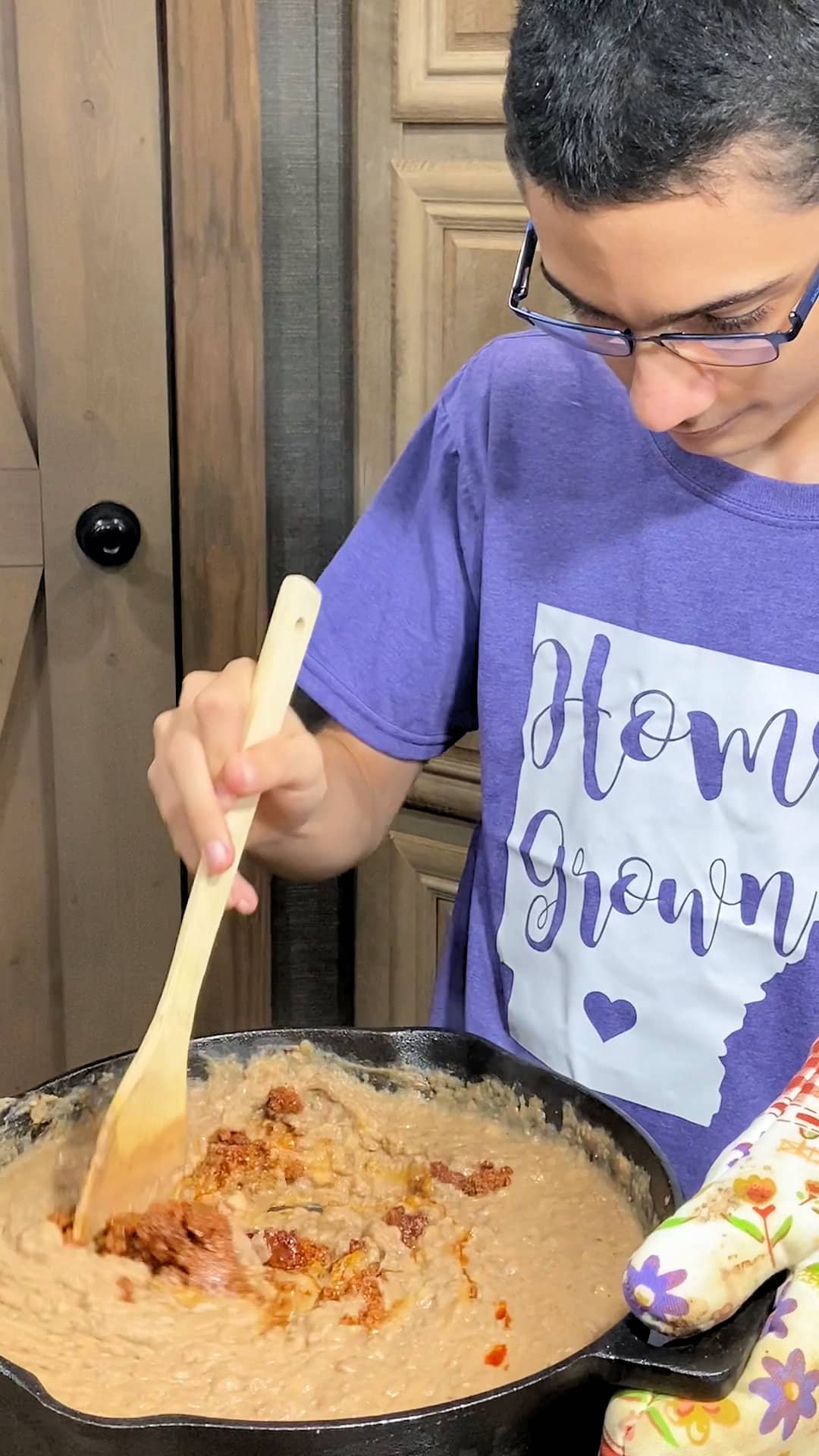 stirring chorizo into refried beans