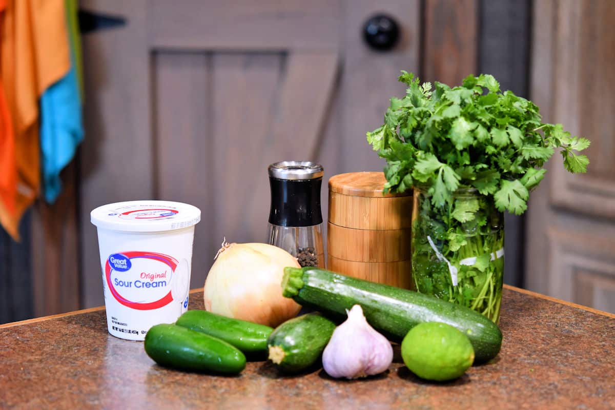 fresh ingredients for zucchini pasta sauce on a countertop