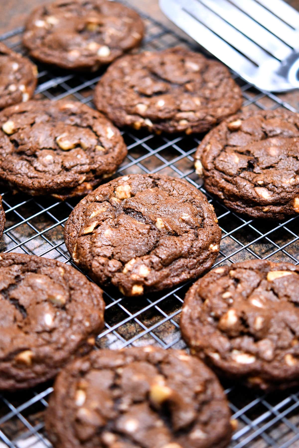 freshly baked chocolate cookies on a wire rack