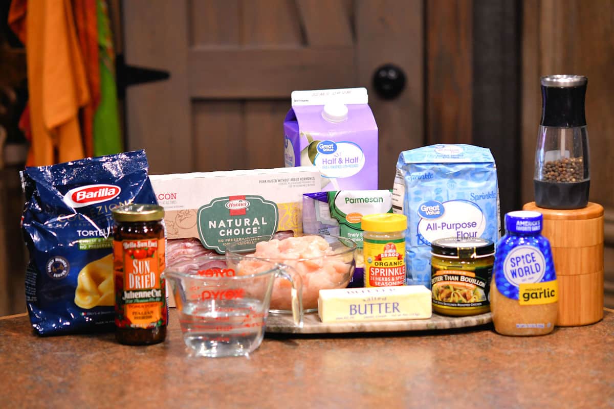 ingredients for marry me chicken tortellini on a countertop