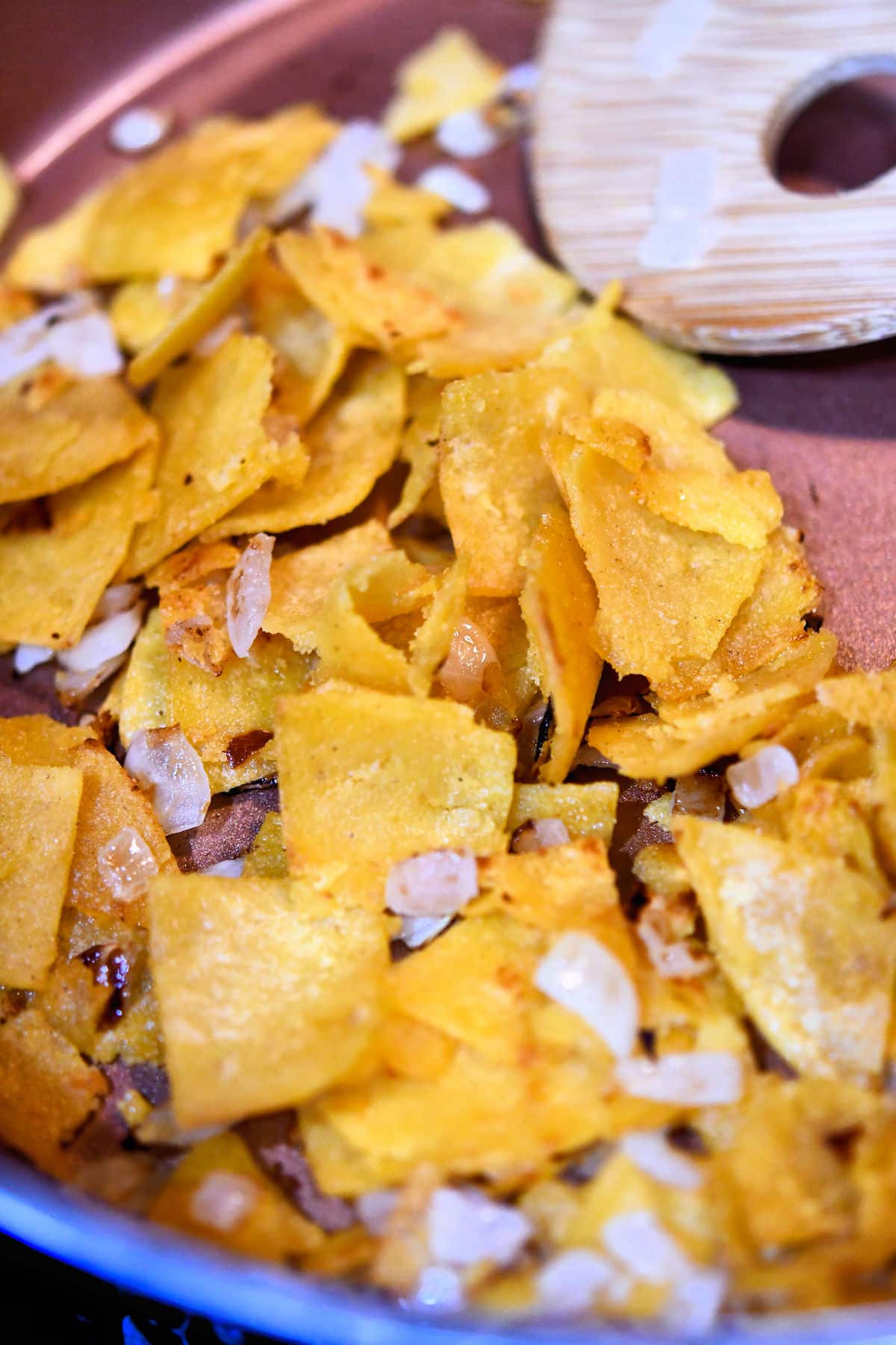 fry the tortillas in a large skillet until crispy