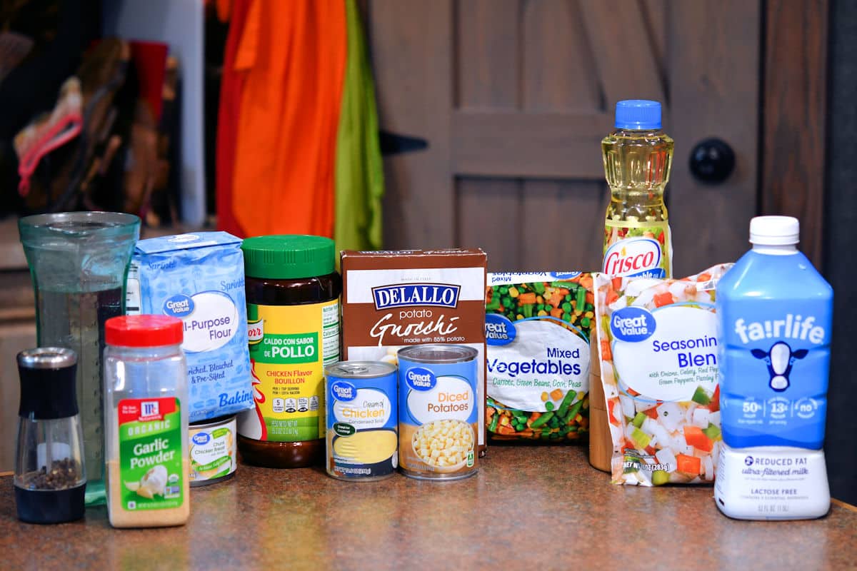 ingredients for creamy chicken and gnocchi soup on a countertop