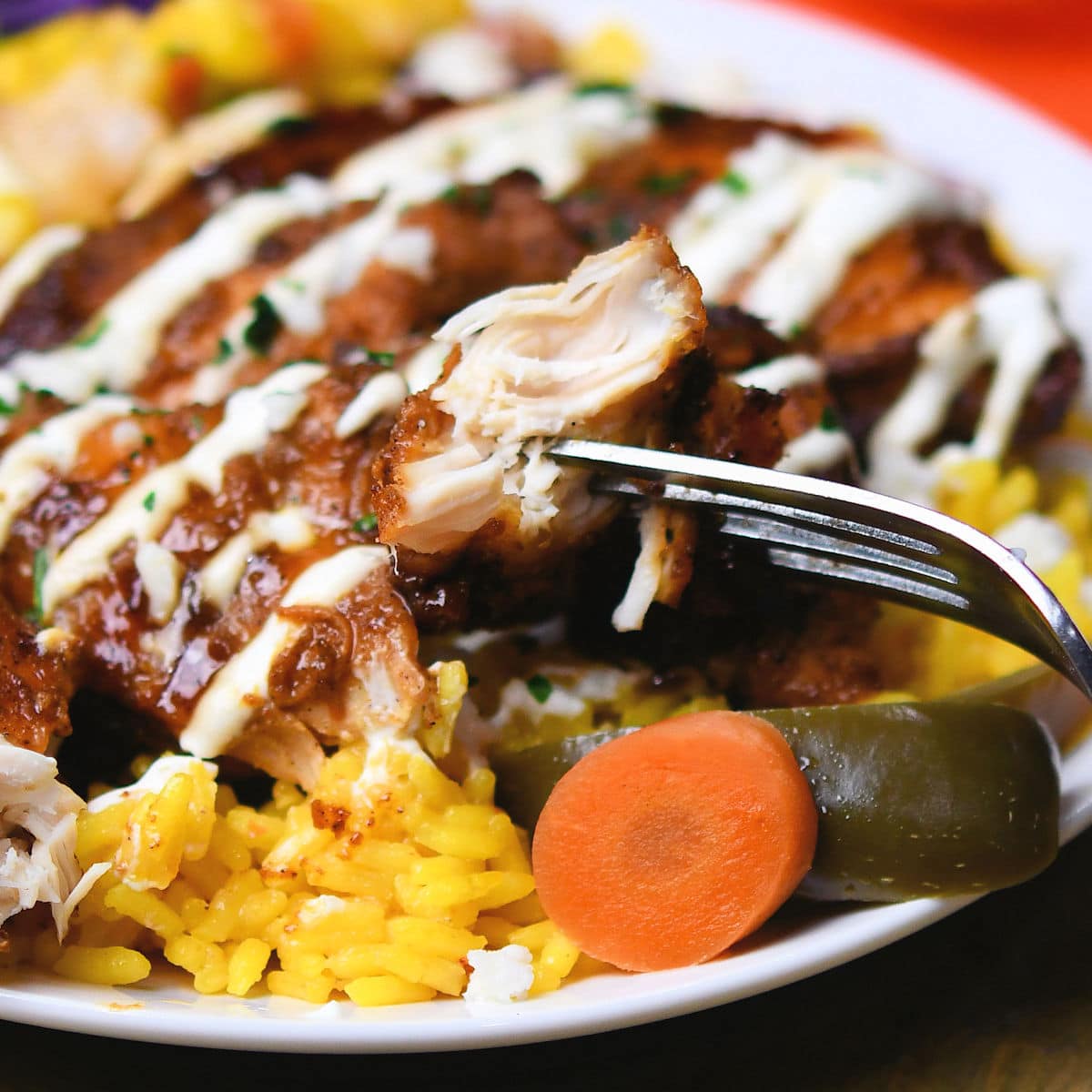 closeup of ancho chicken on a fork