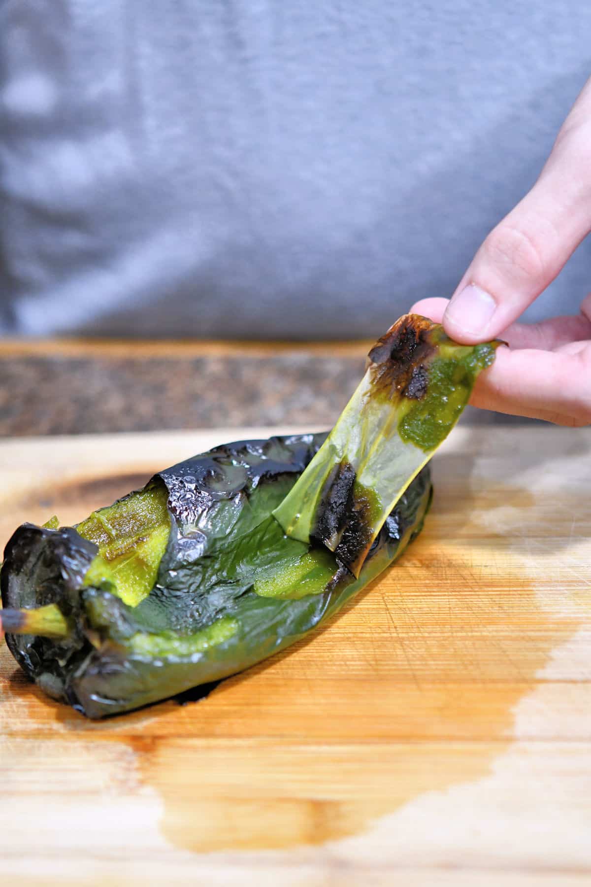 closeup of peeling charred poblano chile