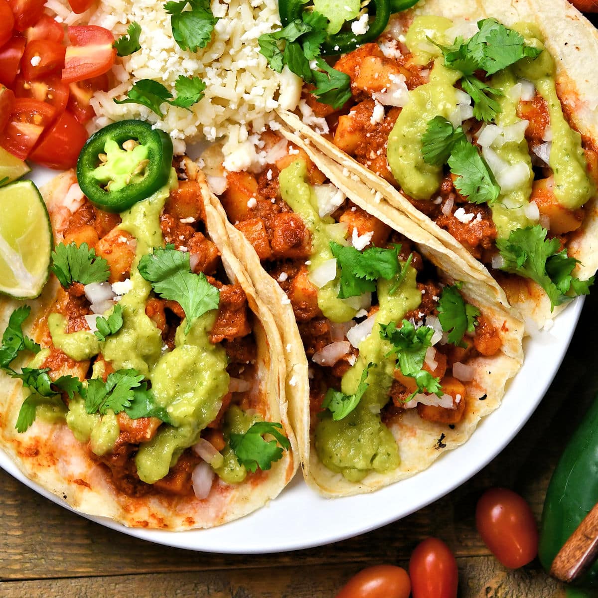 chorizo potato tacos on a white plate